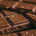 Close-up,Of,A,Rich,,Tempting,Milk,Chocolate,Bar,Broken,Into